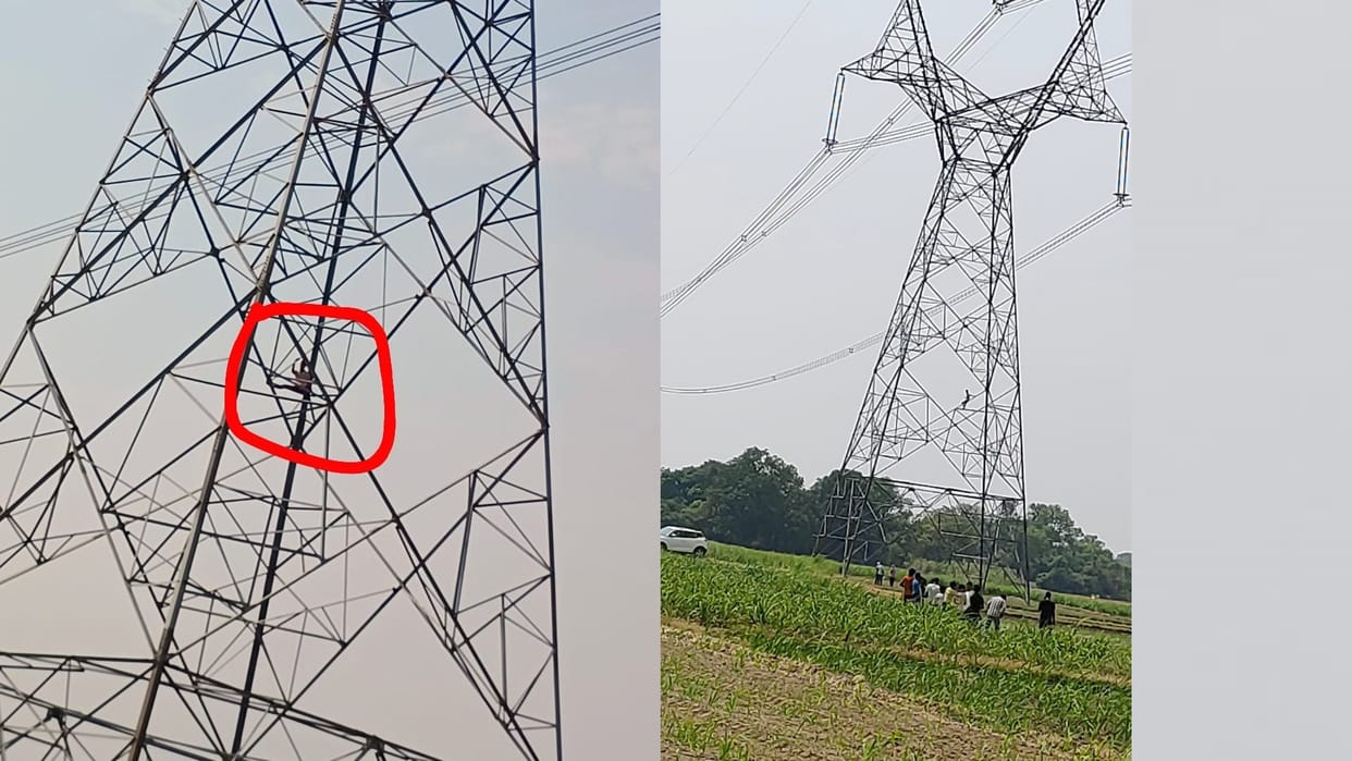 A man climbed on a electric pole in Ambedkarnagar.