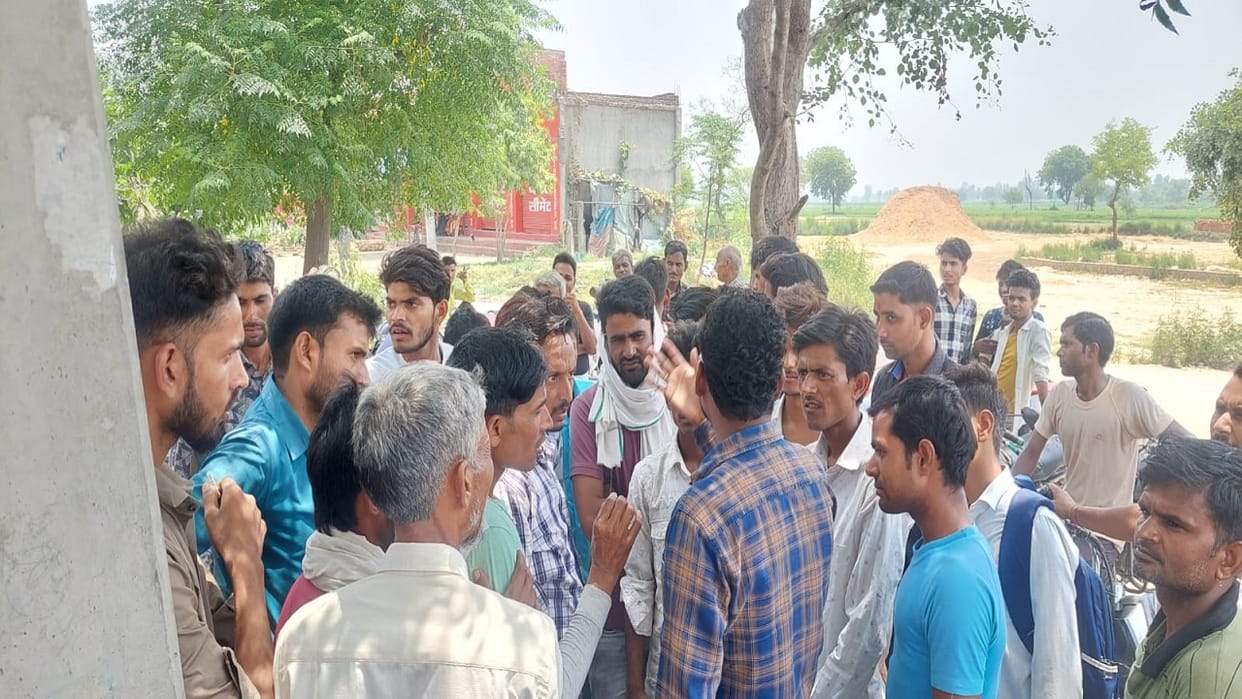 Villagers protests due to power cut JE ran away leaving the car in Budaun