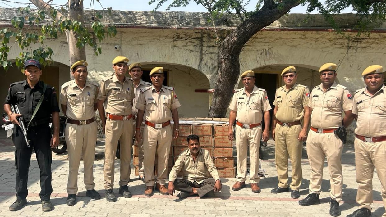 Liquor worth Rs 5 lakh being carried hidden in the cabin of the truck, seized along with the truck