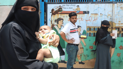 women voters at the polling booth in veil and some in burqa adhi abadi in delhi