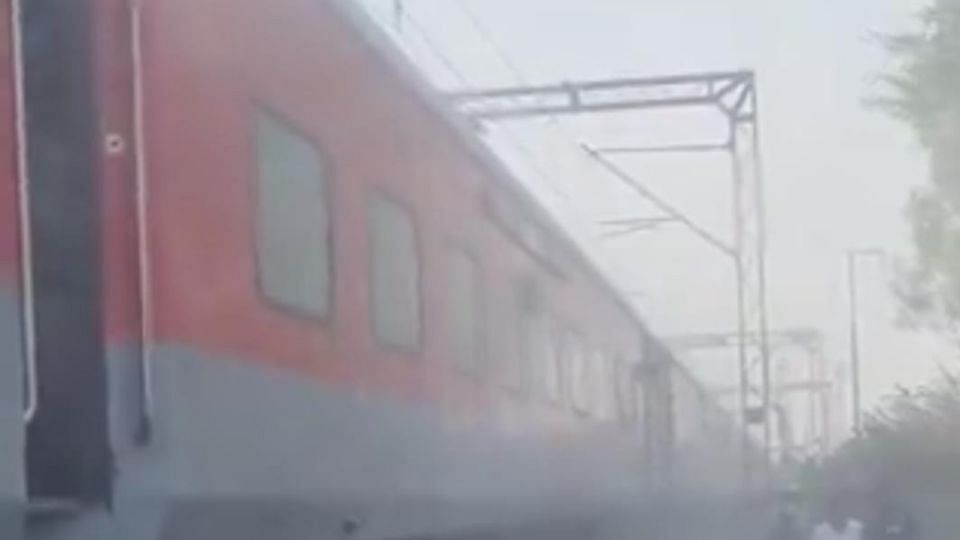 Smoke rising from coach of Rajdhani Express going from New Delhi to Bilaspur