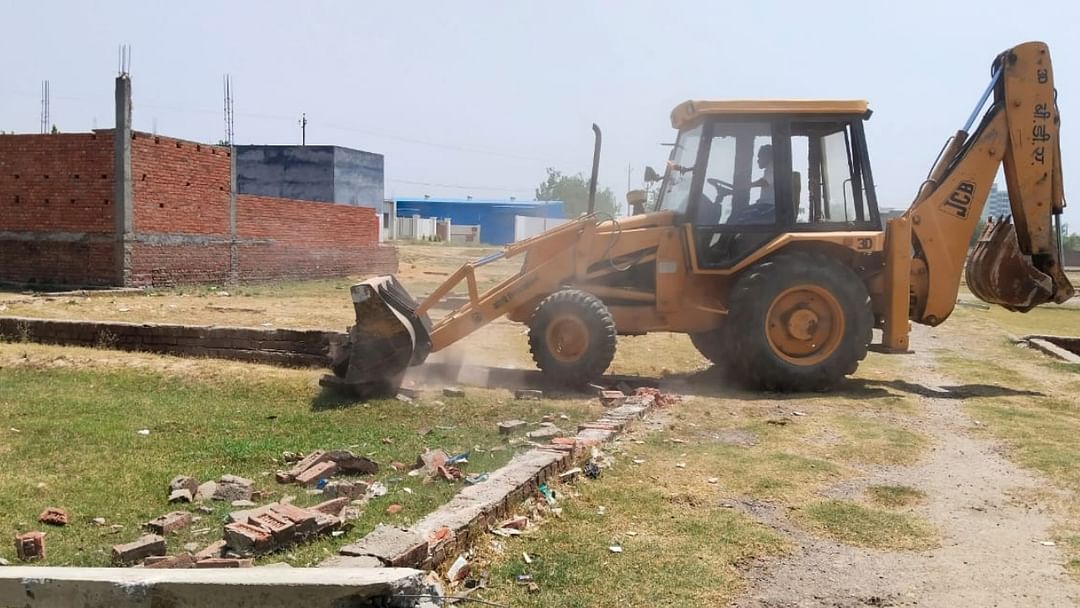 construction demolished with bulldozer who done on government land In Kasganj