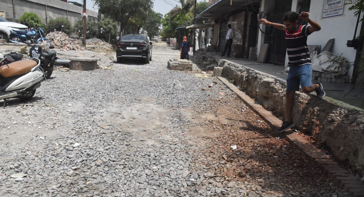The soil of the road was dug out and sold, now contractor is laying interlocking, shows dominance on protest