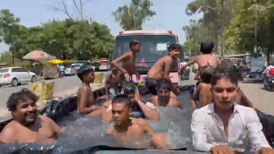 Enjoy swimming pool tractor trolley: Got relief from heat bathing with friends, also ate chole-bhature