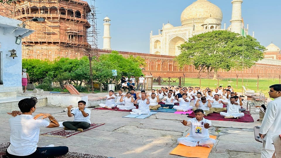 Police officials of Taj Security and Tourism Police Yoga at Dussehra Ghat in Agra on International Yoga Day
