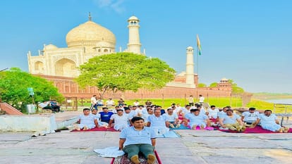 Police officials of Taj Security and Tourism Police Yoga at Dussehra Ghat in Agra on International Yoga Day