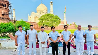 Police officials of Taj Security and Tourism Police Yoga at Dussehra Ghat in Agra on International Yoga Day