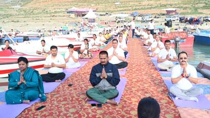 International Yoga Day 2024 Uttarakhand baba Ramdev People including ministers did yoga Watch Photos