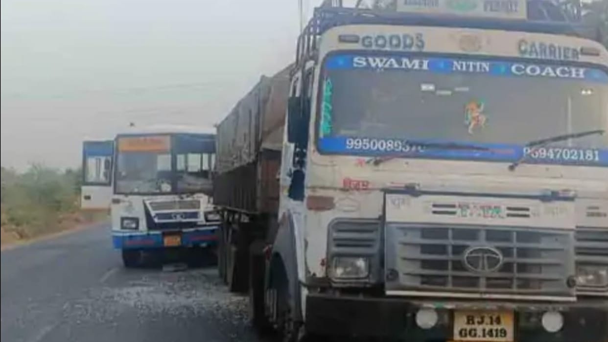 The roadways bus coming from behind collided with the trailer driver when he applied brakes