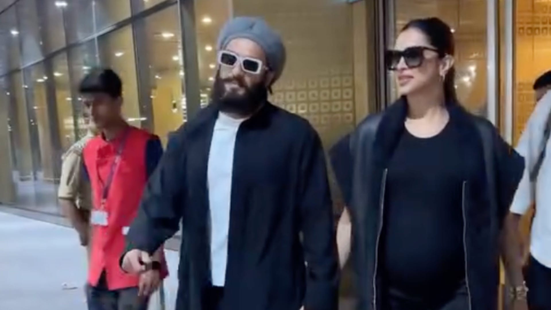 Deepika Padukone and Ranveer Singh spotted at Mumbai airport smiling holding hands post babymoon in London