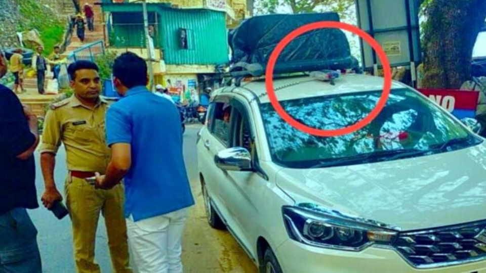 Uttarakhand Police issued challan of UP Deputy SP for  flaunting his power while sitting in car