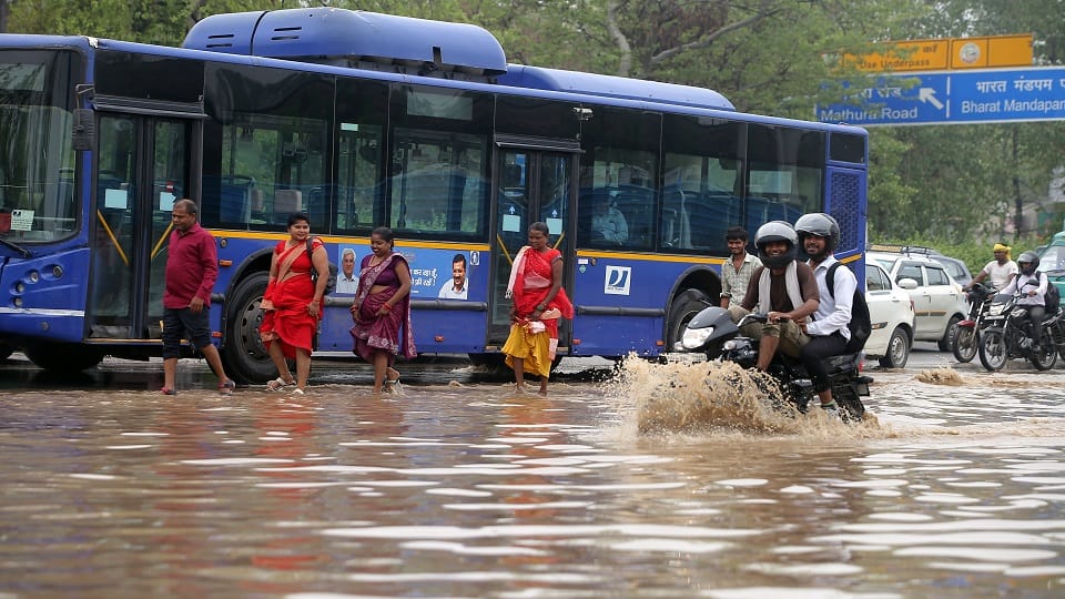 pictures of Heavy Rain In Delhi Roads Flooded Car Submerged Traffic Crawls