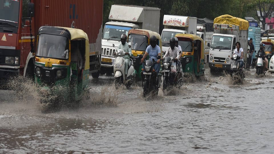 pictures of Heavy Rain In Delhi Roads Flooded Car Submerged Traffic Crawls