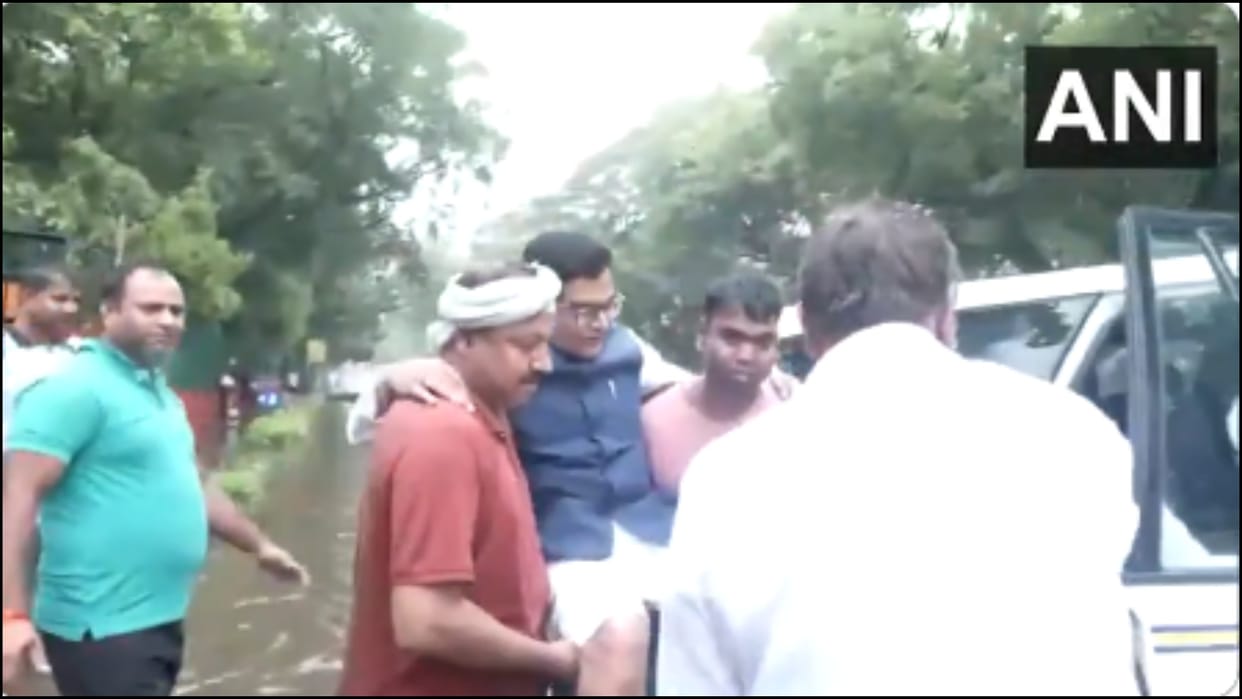 Monsoon in delhi SP MP Ram Gopal Yadav being helped by members of his staff and others to his car news