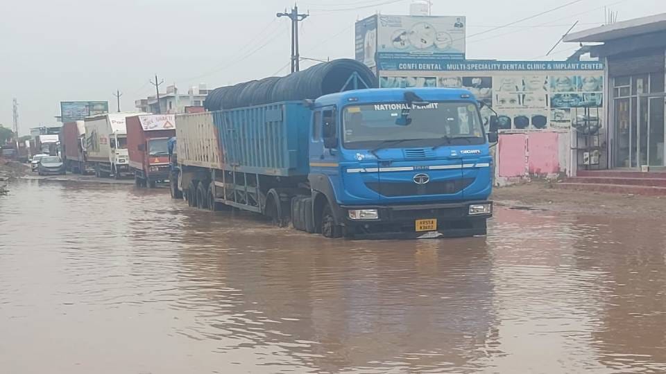 Chest-deep water on Delhi Highway Vehicles stuck creating long jam see photos