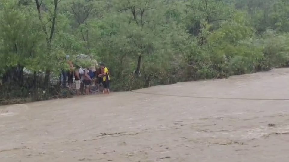 Dehradun Rainfall Waterlogging and 10 tourist Stuck in Guchhupani SDRF rescued Photos