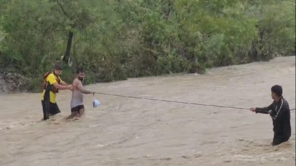 Dehradun Rainfall Waterlogging and 10 tourist Stuck in Guchhupani SDRF rescued Photos