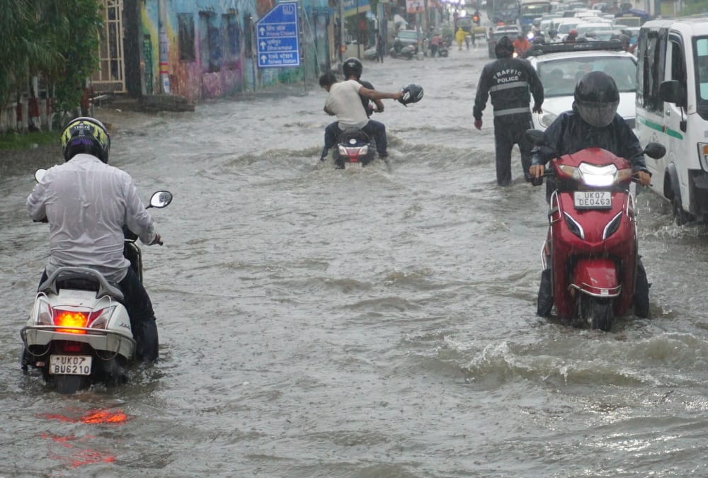 Dehradun Heavy Rainfall Waterlogging in city many Colony Vehicles Drown on Road Photos