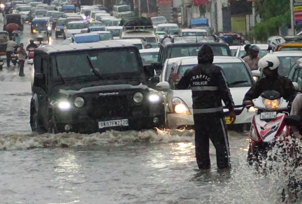 Dehradun Heavy Rainfall Waterlogging in city many Colony Vehicles Drown on Road Photos