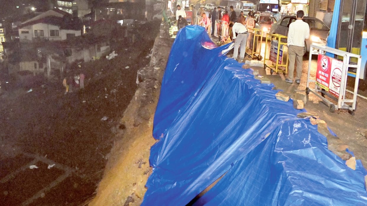 Circular Road collapsed at the local bus stand, water entered the shops on Mall Road