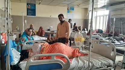 Attendants bringing fans to provide relief from heat to pregnant women admitted in government hospital in Agra