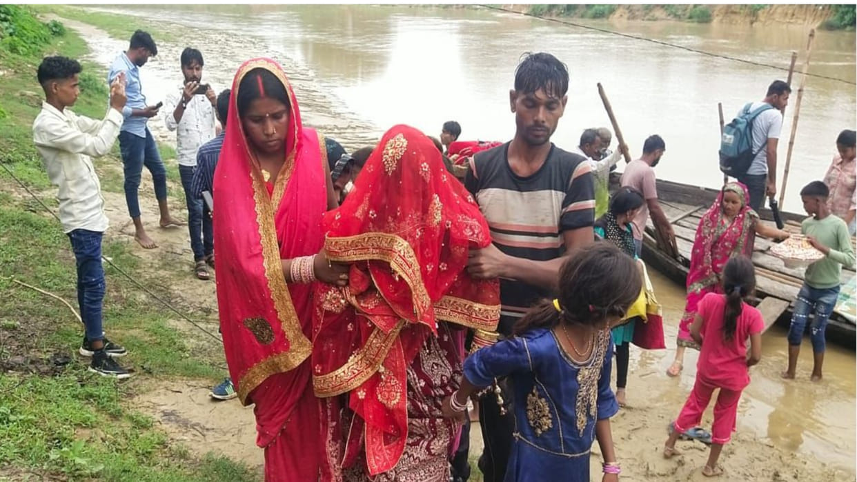 After the wedding in Maharajganj, the bride and groom reached Karwa village by boat as it was flooded