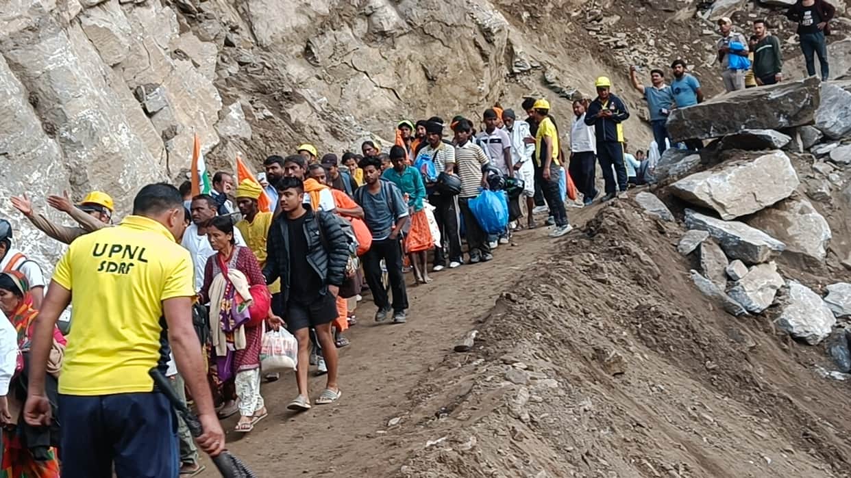 Badrinath Highway opened after 83 hours Pilgrims relief Vehicle Movement Starts Photos