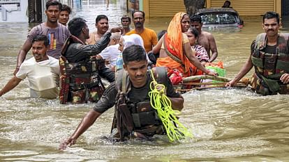 flood in UP 800 villages surrounded thousands of people migrated water on highway See Photos