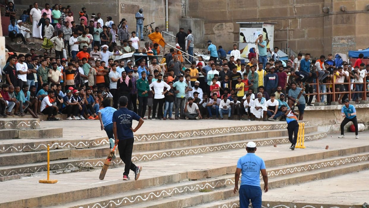 cricket on ganga ghat of kashi ball goes into the river it is out among the spectators two runs