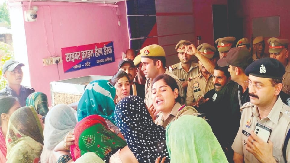 Woman burnt alive in police station aligarh lighter fell during scuffle son picked it up and lit it