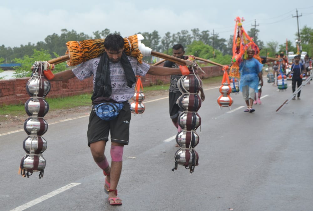 Kanwar Yatra 2024 More Than Two lakh devotees collect gangajal from Haridwar on first day Photos