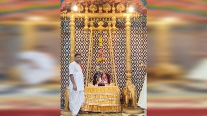 Rajadhiraj seated in a gold and silver swing