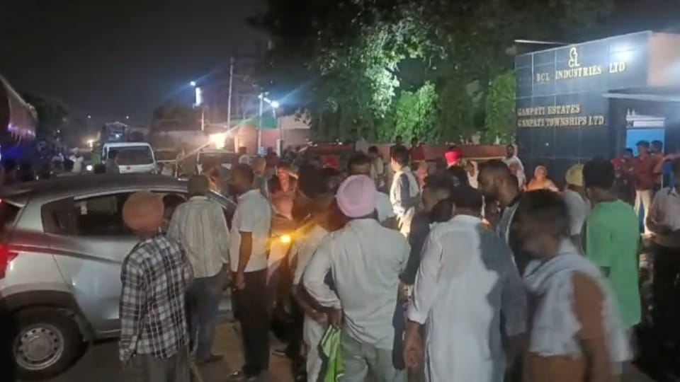 People troubled by ash coming out of Bathinda chemical factory sit on dharna