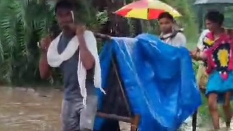 family carried pregnant woman on a cot and took her to the ambulance In Sukma