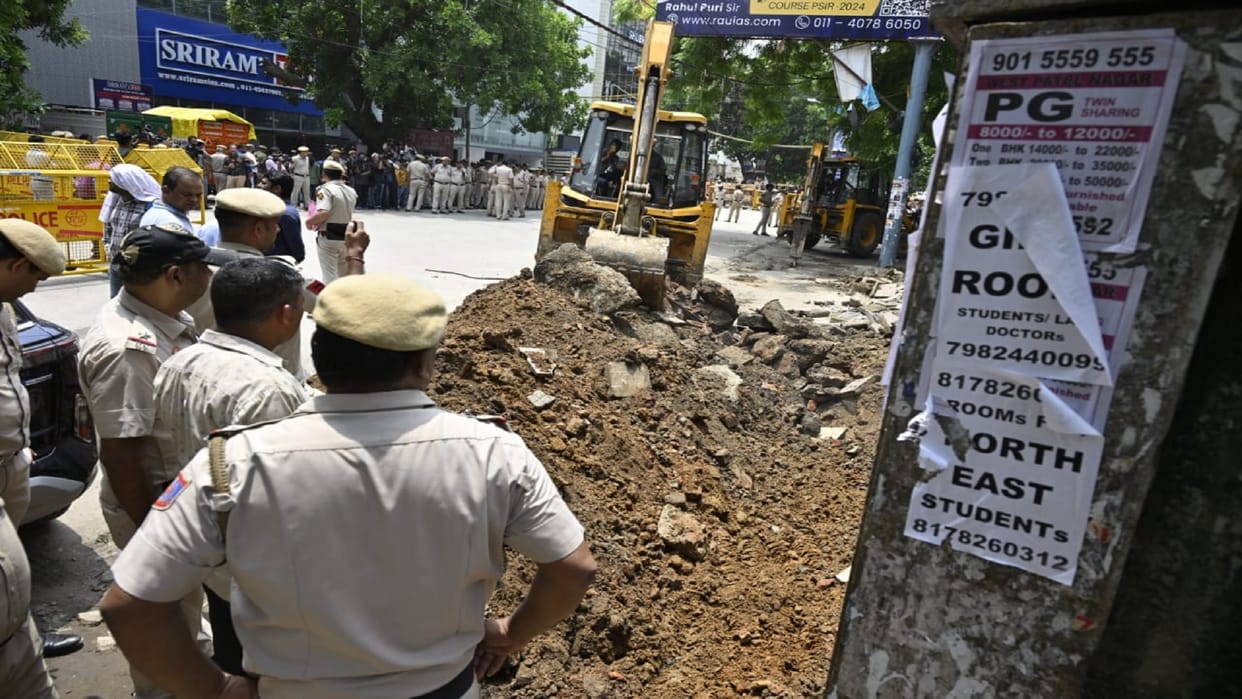 Delhi Coaching Centre Flooded Earth movers put into action to remove encroachment over drain in Rajinder Nagar