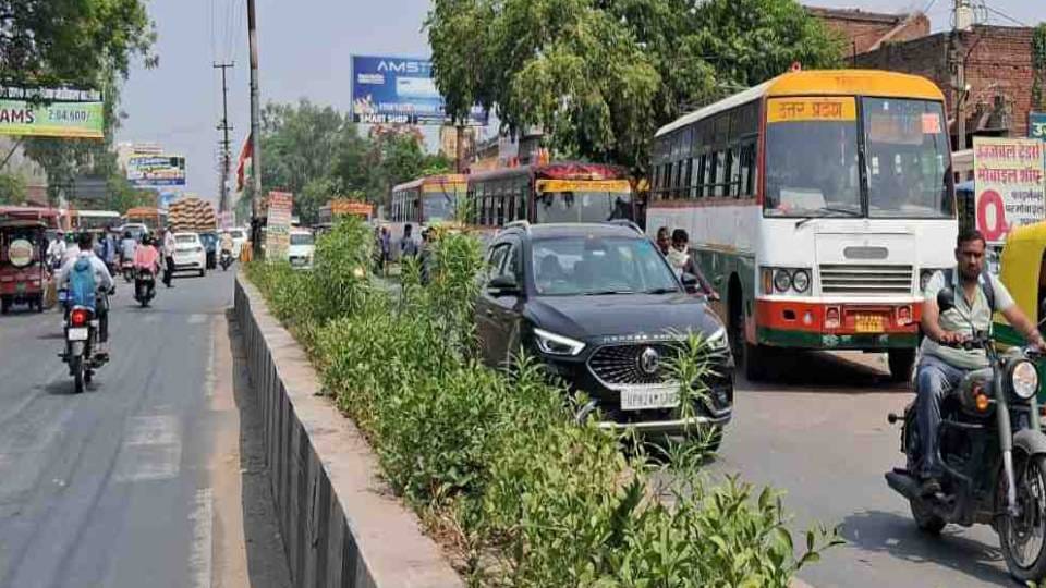 private bus drivers park in front of government bus stand and pick up passengers In Etah