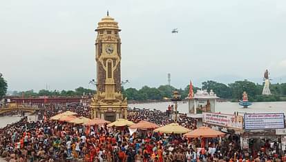 Kanwar Yatra 2024 CM Dhami welcome Kanwariyas in Haridwar flower shower from Helicopter Photos