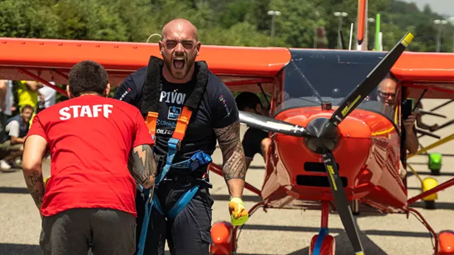 Italian man pulls three planes while walking on his hands in remarkable feat of strength