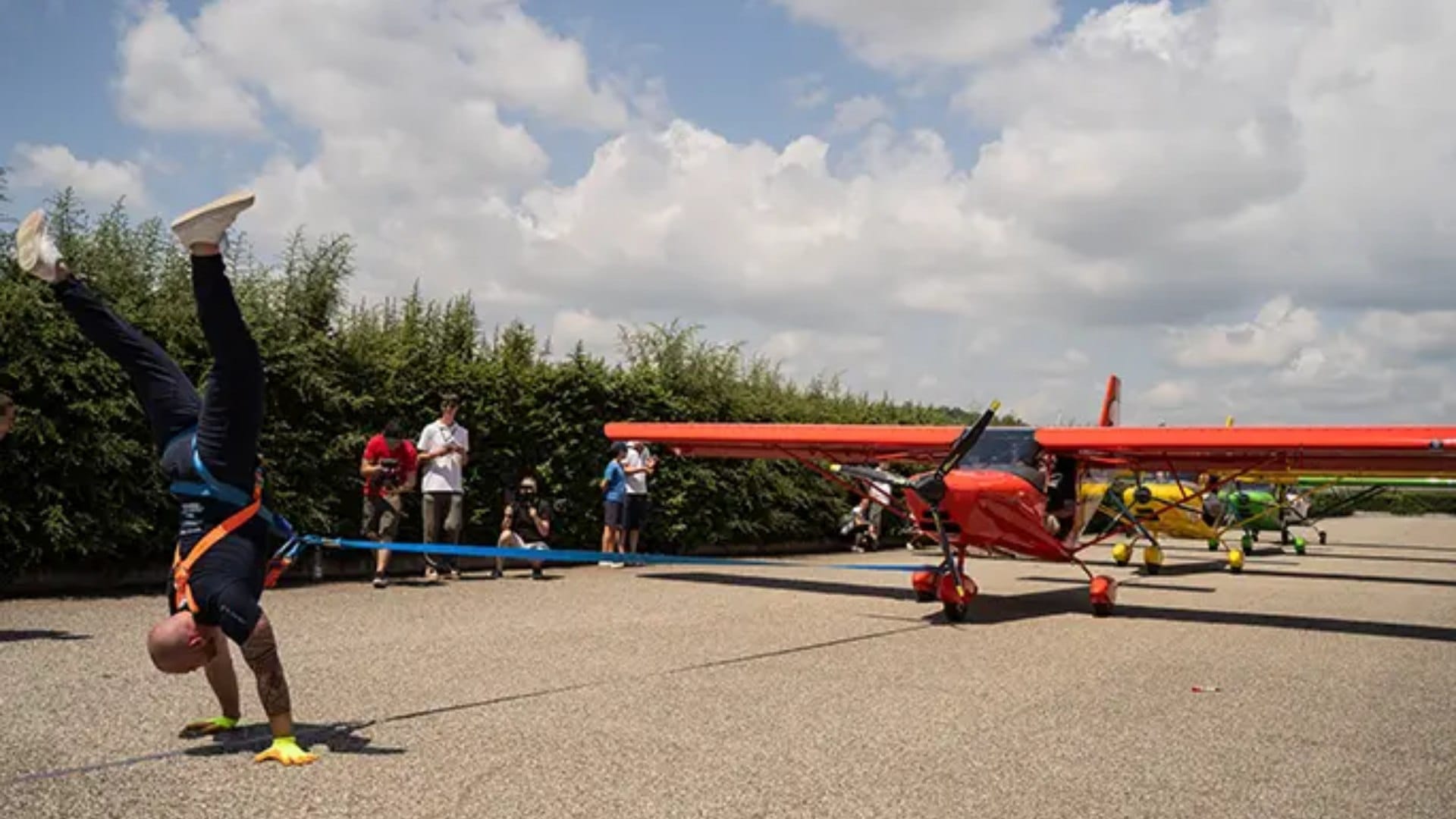 Italian man pulls three planes while walking on his hands in remarkable feat of strength