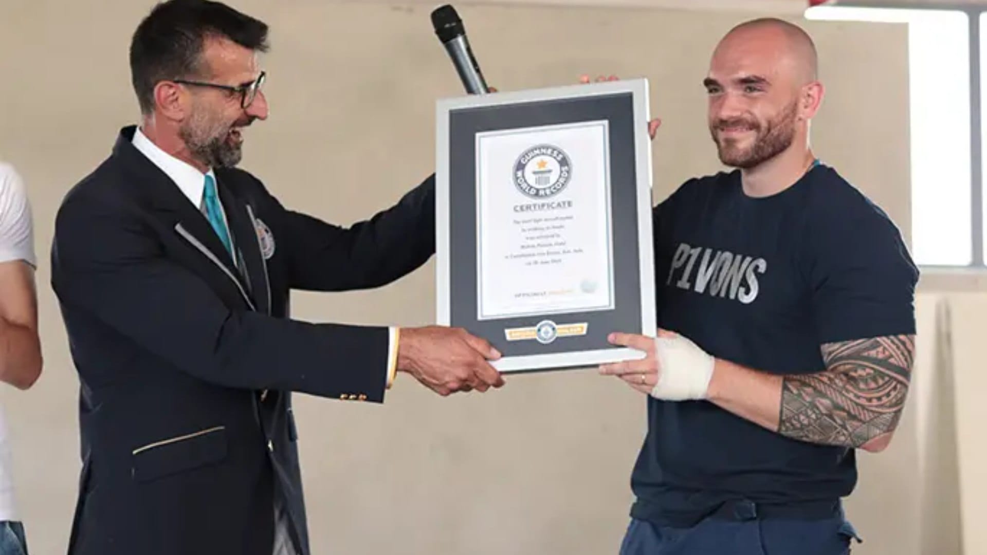 Italian man pulls three planes while walking on his hands in remarkable feat of strength