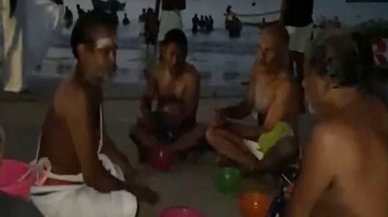 Devotees take holy dip at Thoothukudi harbour beach on Aadi Amavasai in Tamil Nadu