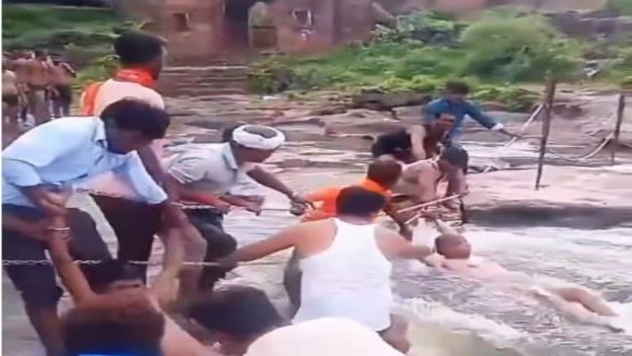 Chittorgarh: Youth who went for picnic got swept away in waterfall, saved after getting stuck in the railing