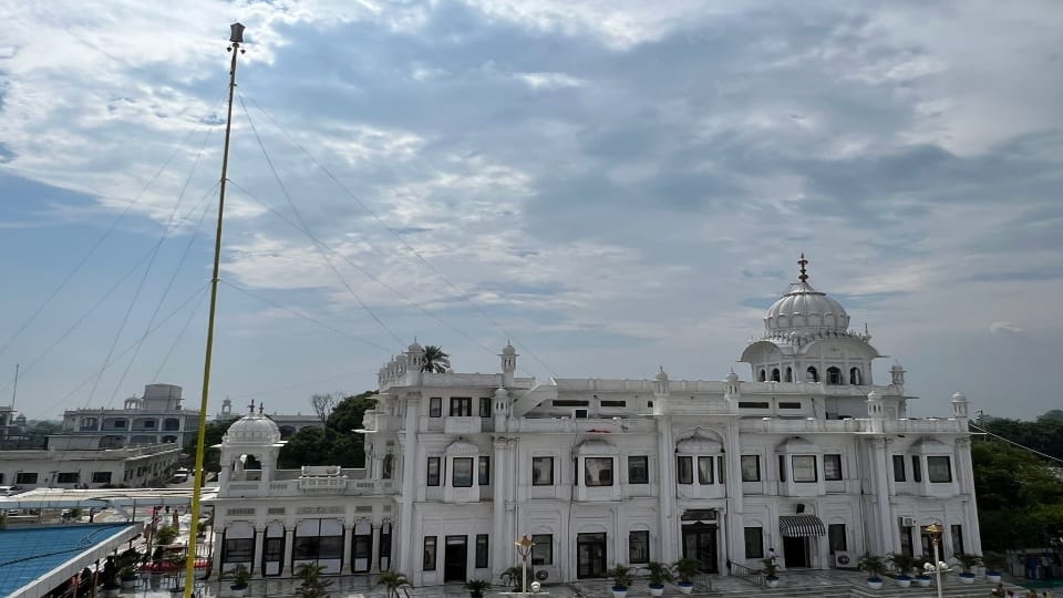 Basanti Nishan Sahib fluttering in the historical Gurudwara Sri Ber Sahib of Guru Nanak Dev city