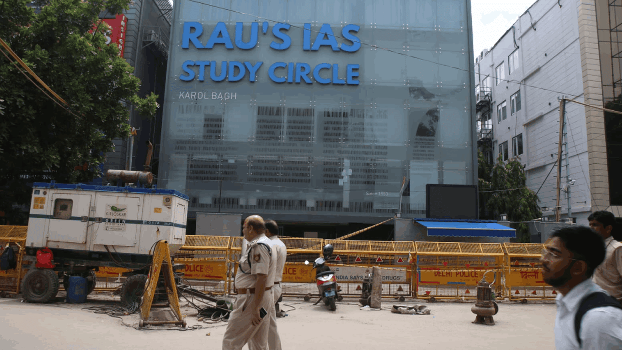 Delhi Coaching Centre Deceased student Navin Delvin maternal uncle sitting in front of coaching centre