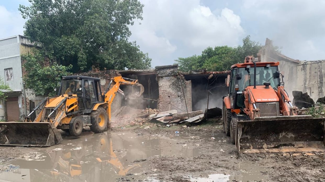 100 year old dilapidated warehouse demolished using bulldozer in varanasi