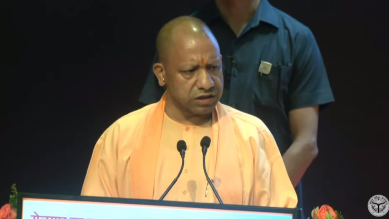 CM Yogi Adityanath distributes joining letter to applicants.