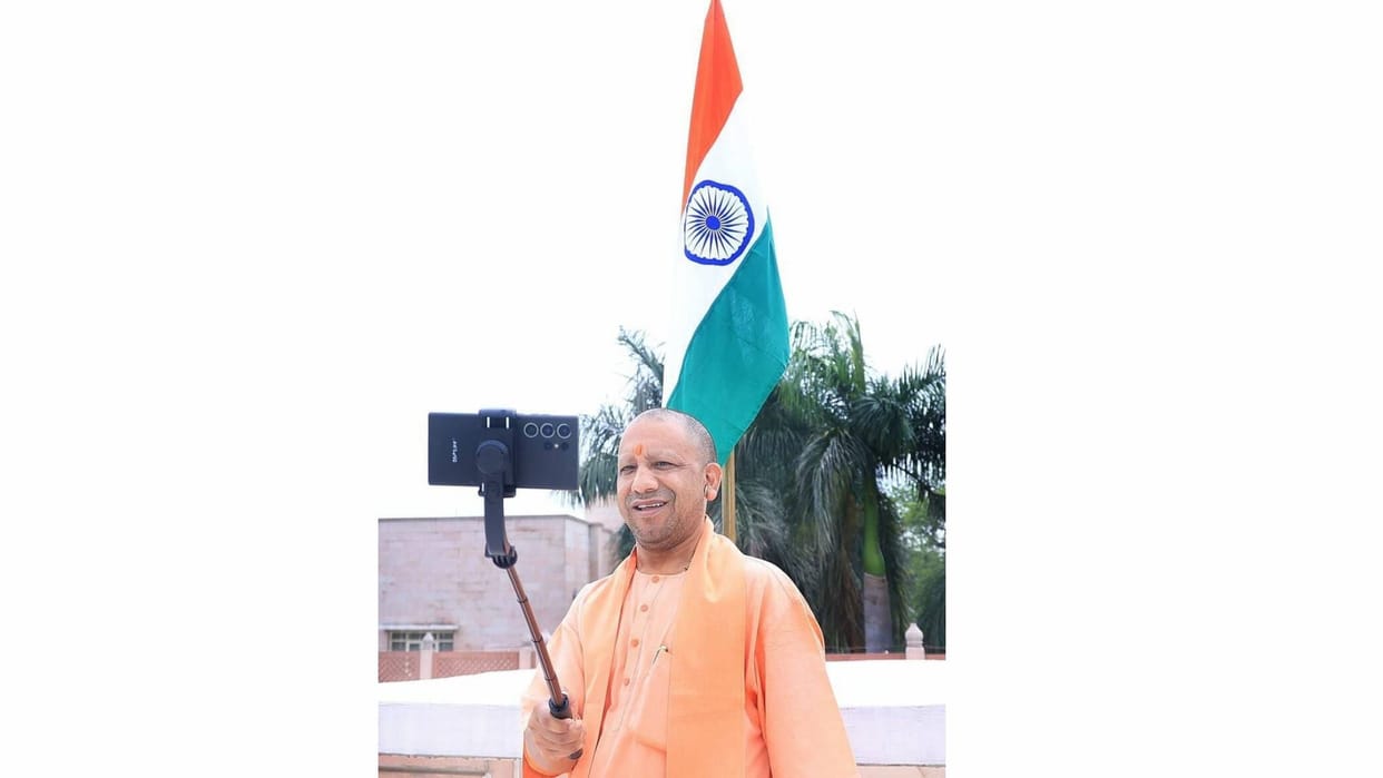 CM Yogi Adityanath takes selfie with tiranga in his house.