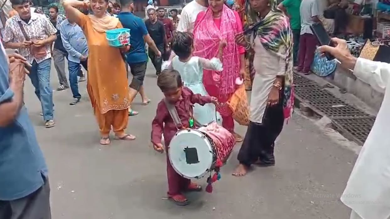 Una News Chintapurni Seven year old Raju is fulfilling his household responsibilities by playing drums