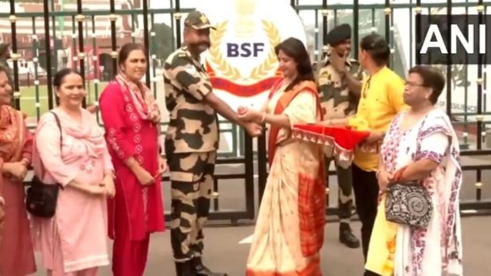 Raksha Bandhan women tie rakhi and offer sweets to BSF Jawans at Attari Wagah border in Amritsar