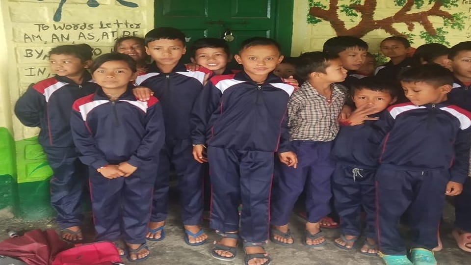 children sat in the verandah for two hours waiting for teacher arrival in almora